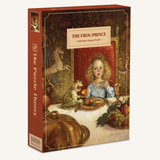 A 1000-piece jigsaw puzzle box titled 'The Frog Prince' by Jim Gentry. The box features an illustration of a young girl in a blue dress sitting at a table with a frog, set against a dark, ornate background.