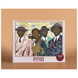 Puzzles of Color packaging with a group of people on a beige background