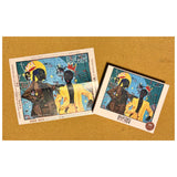 Two puzzle pieces with artwork on a cork background