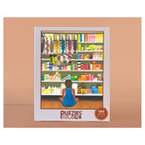 Puzzles to Color packaging with a colorful illustration of a person looking at products in a store.