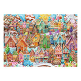 Colorful gingerbread village scene with houses and cars on a white background