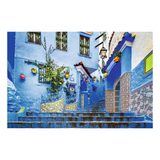 Colorful street scene with blue buildings and decorative elements in a Mediterranean style.