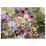 Floral arrangement materials including flowers, twine, and tools on a white background