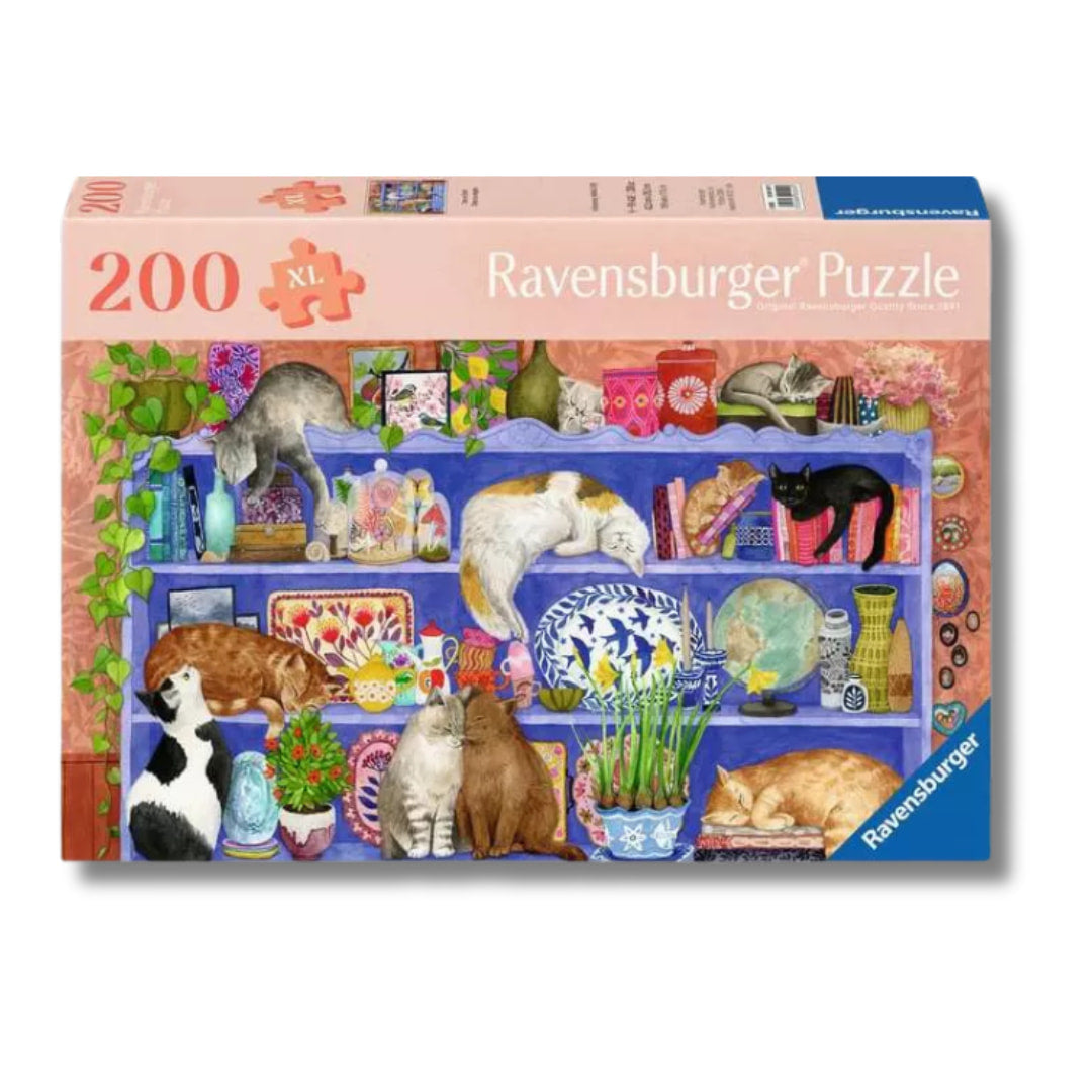 Ravensburger puzzle box with cats on shelves design