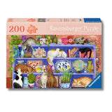 Ravensburger puzzle box with cats on shelves design