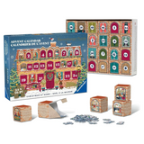 A Christmas advent calendar puzzle set shown with its illustrated blue box, the opened calendar face, several small wooden puzzle boxes, loose puzzle pieces, and the assembled calendar on a white background.