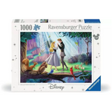 A Ravensburger Disney 1000-piece jigsaw puzzle box, Collector's Edition. The front of the box features a colorful illustration of a fairy tale couple in a forest with squirrels and other animals, set against a clean white background with blue brand accents.