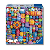 Ravensburger puzzle box with colorful beads design on a white background