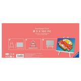 Ravensburger 'Ravenburger Puzzle' 3 x 100 piece jigsaw puzzle box, featuring a pink background with white text and icons, and a preview of the completed puzzle showing a bacon and egg sandwich on toast.