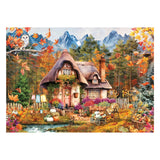 Cozy cottage in a forest with autumn foliage and mountains in the background