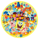 A round yellow beach towel or mat featuring a colorful cartoon illustration from SpongeBob SquarePants, with the text 'Welcome to Bikini Bottom' and 'Jellyfish Fields' surrounded by characters like SpongeBob, Patrick, Krabs, and Bob's Burgers on a white background.