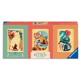 Ravensburger 3-piece jigsaw puzzle box set, featuring three colorful puzzle designs: a white cat painting on a green background, a red panda and pagoda on a coral background, and a blue dragon with a black pagoda on an orange background.