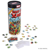 Marvel Giant-Size X-Men jigsaw puzzle set with a tall illustrated cylindrical storage tin, scattered loose puzzle pieces, a small instruction card, and a few larger puzzle pieces on a white background.