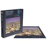 Pink Floyd puzzle set with packaging showing a scene from 'A Momentary Lapse of Reason'.