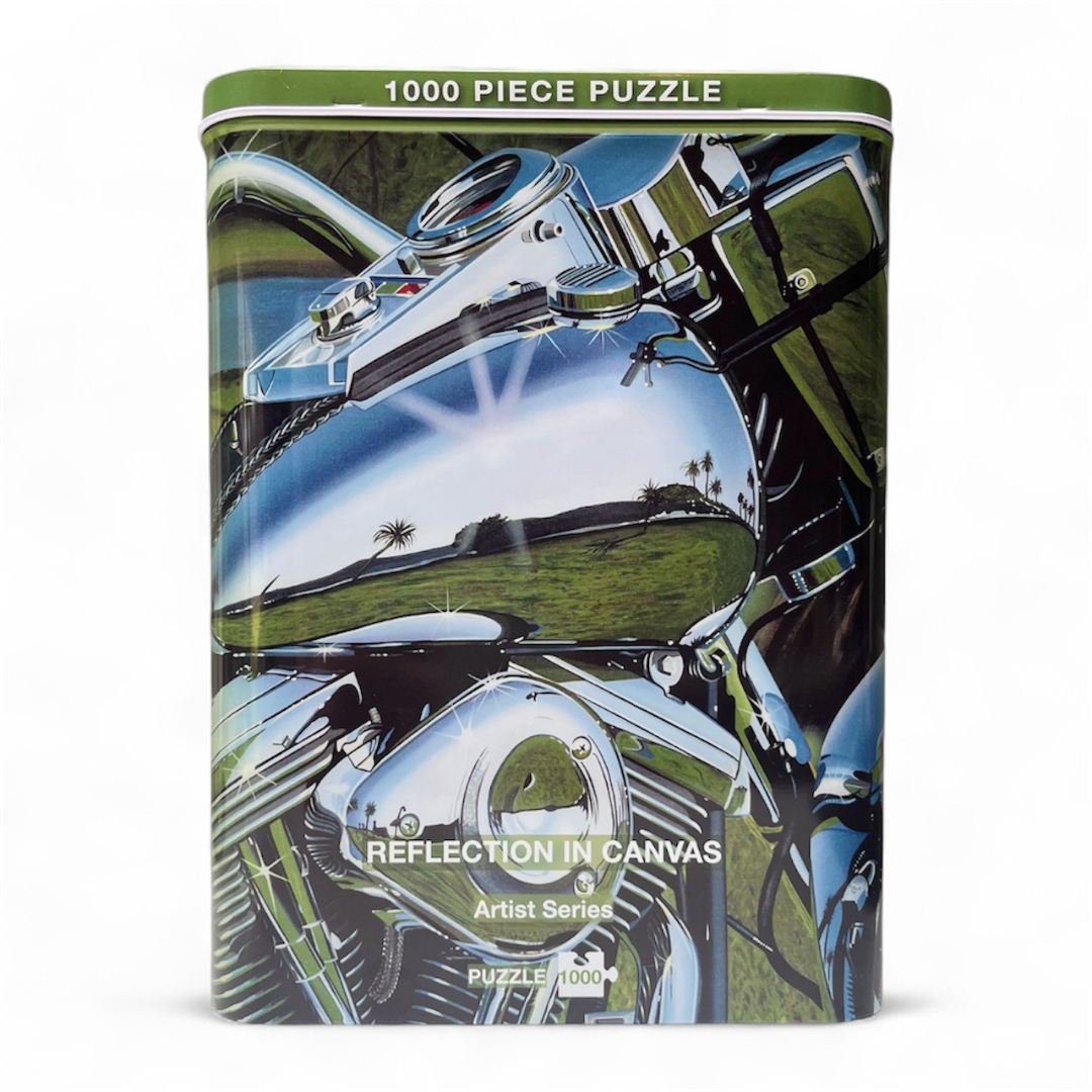 Puzzle box with motorcycle artwork and 'Reflection in Canvas' text on a white background