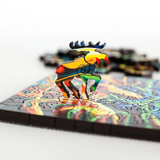 Colorful moose-shaped puzzle piece on a partially completed puzzle with a white background