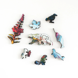 Set of colorful animal-shaped puzzle pieces on a white background
