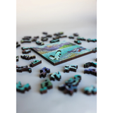 Jigsaw puzzle with wooden beaver on a white surface