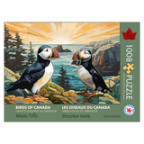 Jigsaw puzzle packaging featuring Atlantic Puffins on a rocky shore with a sunset background.