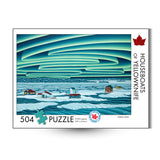 Puzzle box with a scenic illustration of houseboats on water and a stylized sky, featuring the title 'Houseboats of Yellowknife' by Robbie Craig.