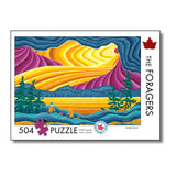 Puzzle packaging with colorful mountain design and 'The Foragers' branding