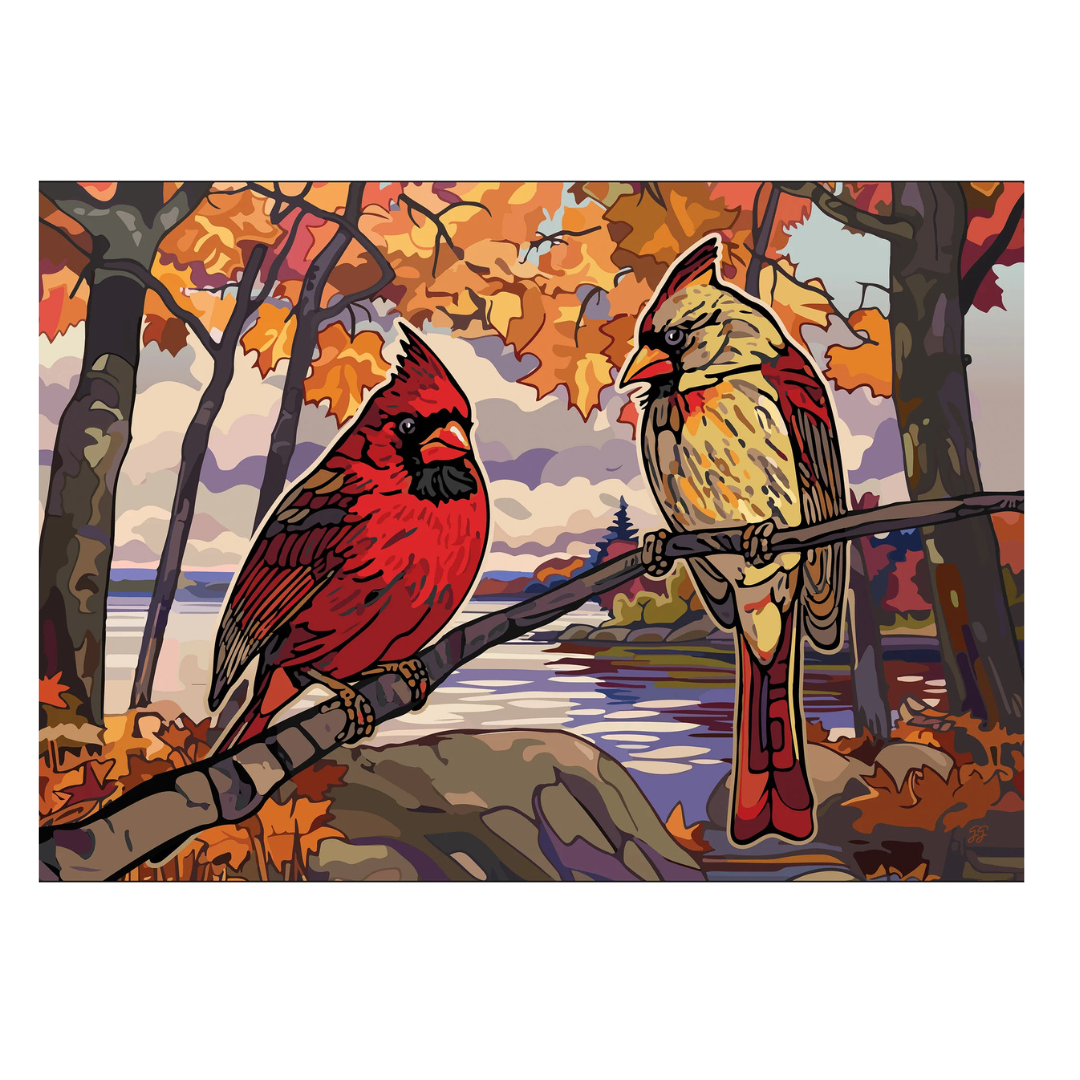 Two cardinals on a branch with autumn foliage and a lake in the background