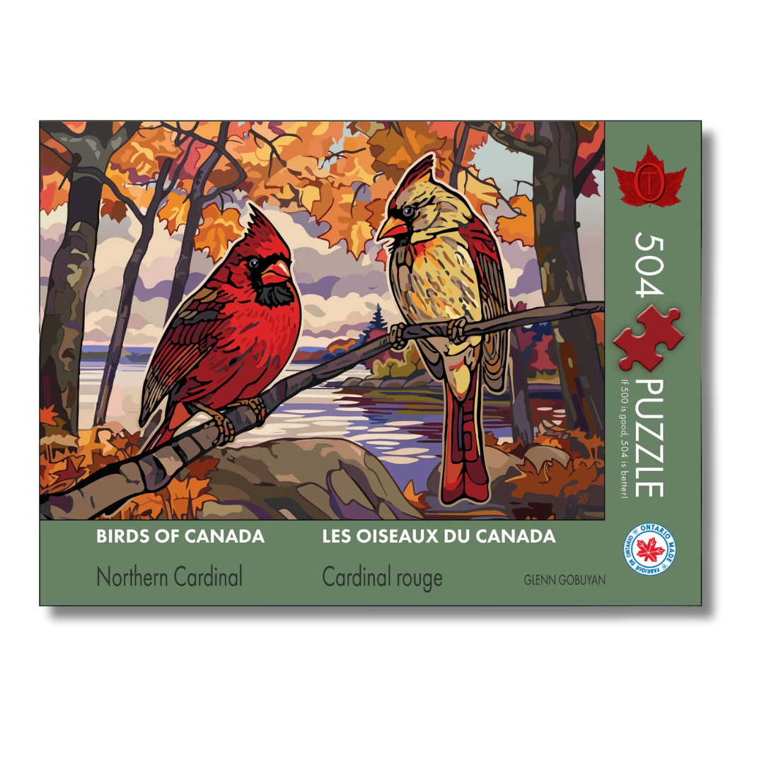 Jigsaw puzzle box featuring two cardinals in a autumn landscape with 'Birds of Canada' branding.