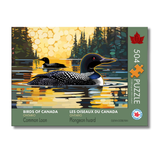 Jigsaw puzzle box featuring a Common Loon on a lake with a sunset background, labeled 'Birds of Canada'.