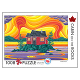 Jigsaw puzzle packaging with a colorful design of a cabin on rocks and swirling patterns, featuring the artist 'Robbie Craig'.