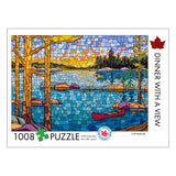 Jigsaw puzzle packaging with a lake and trees design, featuring a red maple leaf.