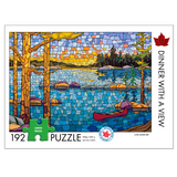 Jigsaw puzzle packaging with a scenic lake design and 'Dinner with a View' text.