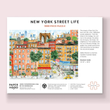 New York Street Life puzzle packaging with colorful illustration of a city street scene.