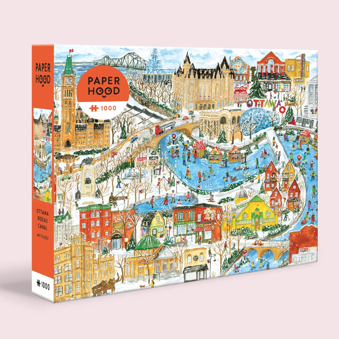 Jigsaw puzzle box with a colorful illustration of a cityscape, featuring the Ottawa Canal.