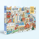 A 1000-piece jigsaw puzzle box by Paper Hood titled 'Snow Day in Toronto', featuring a detailed winter illustration of Toronto with the Toronto CN Tower, snowy streets, and people in the snow. The box is shown at an angle against a light blue background.