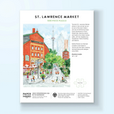 A 500-piece jigsaw puzzle featuring a watercolor illustration of St. Lawrence Market in Toronto, shown on a light blue background.