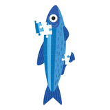 A stylized blue fish made from puzzle pieces on a plain white background.