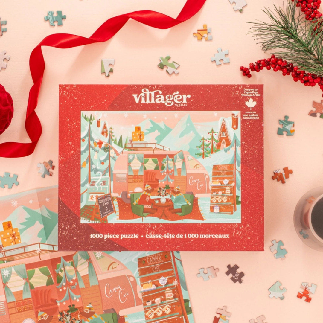 Villager puzzle box with Christmas-themed illustration on a pink background with puzzle pieces and decorations.