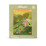 A rectangular puzzle box for a 500-piece village-themed puzzle. The box has a light olive-green border with the brand name 'villager' at the top and a colorful illustrated scene showing a garden, greenhouse, trees, and small buildings.