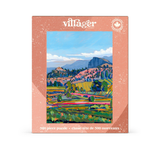 A 500-piece jigsaw puzzle box by Villager Puzzles, featuring a colorful landscape painting of rolling green hills, trees, and mountains under a blue sky, set against a clean white background.