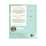 The back of a Villager puzzle box, featuring a light mint green background with white and orange text blocks, a circular photo of the creator Kelsey Vos, and a barcode at the bottom.