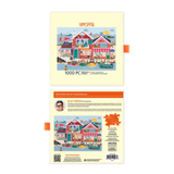 Puzzle packaging with colorful illustration of a coastal scene and 'Werkeshoppe' branding.