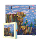 Jigsaw puzzle packaging with colorful highland cow design on a blue sky background