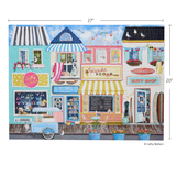 A colorful illustrated storefront scene with beach-themed shop signs including 'Seaside Soap', 'Surf Shop', and 'Ice Cream', shown with dimension markers of 27 inches wide and 20 inches tall. The artwork is signed Cathy Walters.