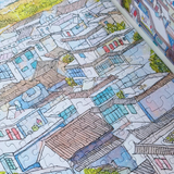 Colorful puzzle of a cityscape with completed sections and missing ones.