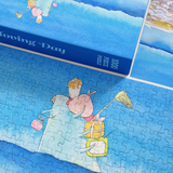 Puzzle with a cartoon character and 'Moving Day' text, partially completed.
