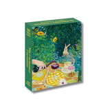 Colorful jigsaw puzle box of a garden scene with a rabbit, sunflowers, and a person with a bottle and glass.