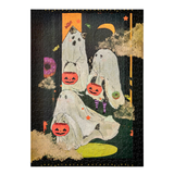 A completed jigsaw puzzle featuring a Halloween-themed illustration of three white ghosts carrying orange jack-o'-lantern buckets against a dark background with stars, clouds, and a crescent moon.