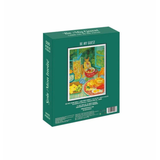 Jigsaw puzzle box with a colorful illustration of a table setting on a white background