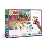 Puzzle box with colorful illustration of children playing in a classroom, featuring a hand holding a piece.