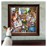 Dog looking at a colorful framed painting of a kitchen scene on a wall with floral pattern.